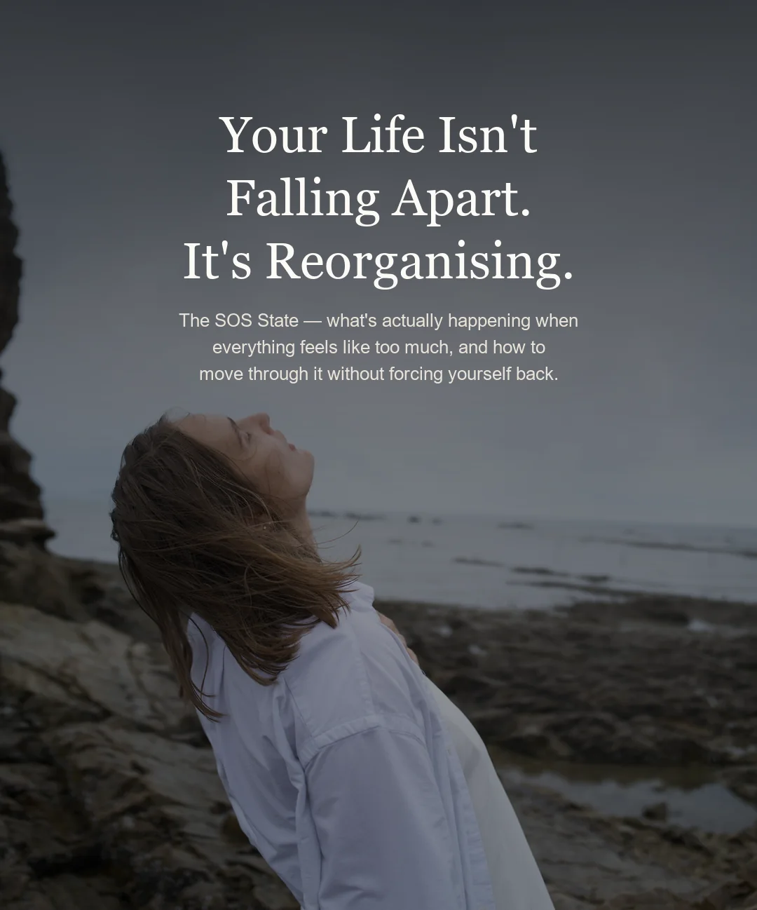 A woman on a grey shoreline with her head tilted back and eyes closed, over the title 'Your Life Isn't Falling Apart. It's Reorganising.'